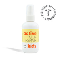Bottle of 'active skin repair kids' spray with a pediatrician recommended stamp on a white background