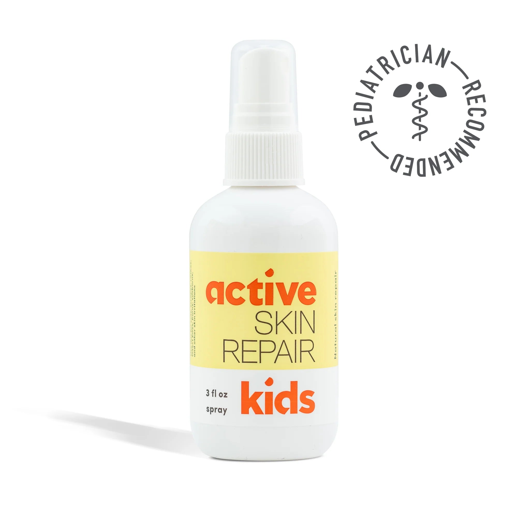 Bottle of 'active skin repair kids' spray with a pediatrician recommended stamp on a white background