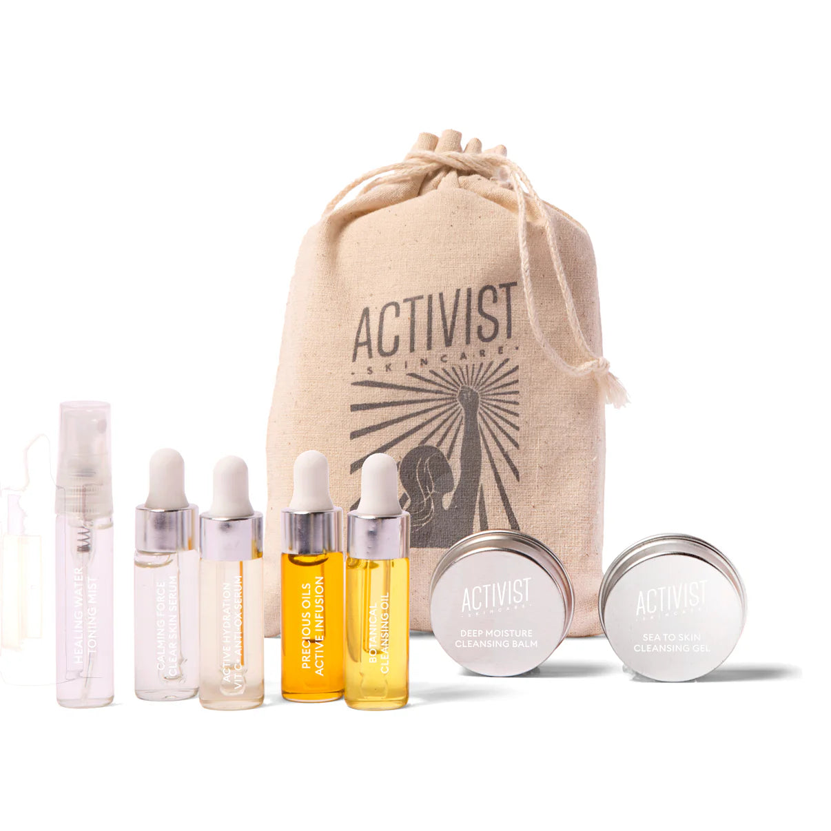 A collection of skincare products from Activist, including three cleansers, a toning mist, two serums, and a face oil, displayed in front of a burlap sack with the brand's logo.