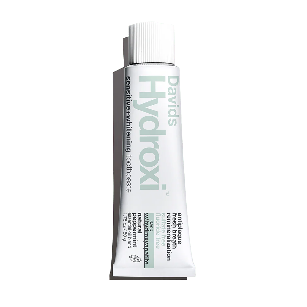 Tube of David's Hydroxi sensitive whitening toothpaste on a white background