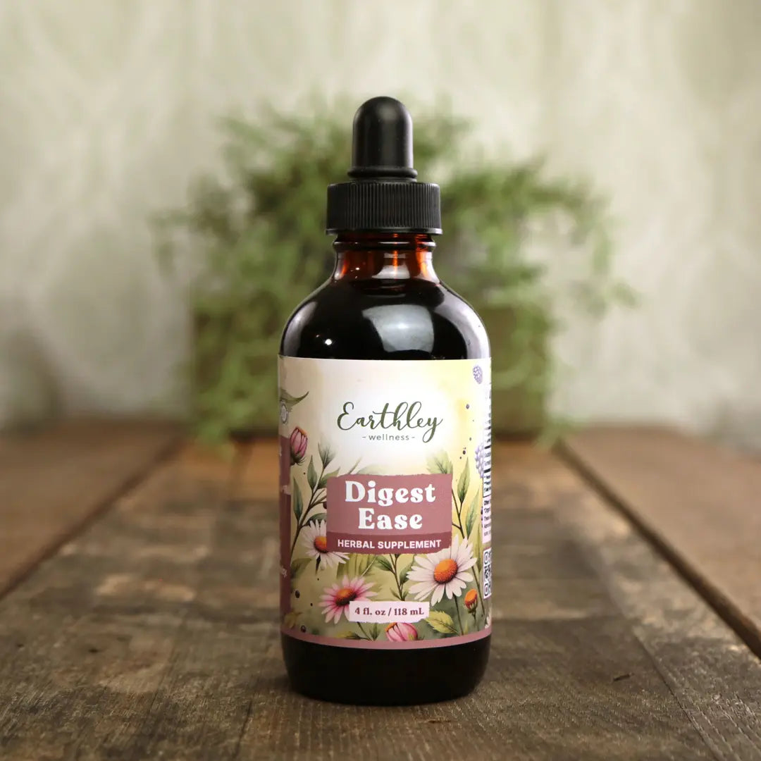 Bottle of Earthly Wellness Digest Ease herbal supplement on a wooden surface with a blurred natural background