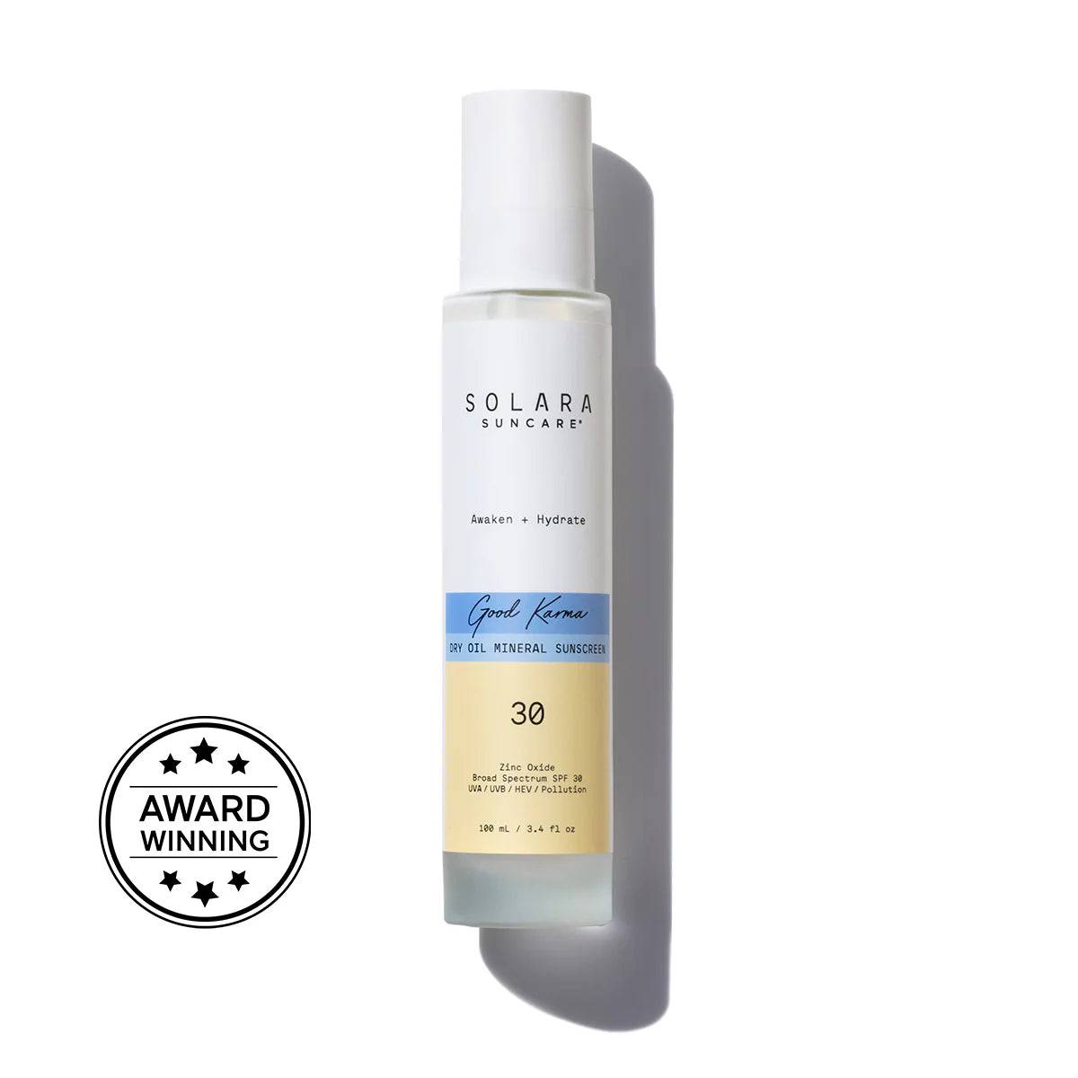 A bottle of Good Karma Dry Oil Mineral Sunscreen, SPF 30 with a white pump, labeled with the brand SOLARA and the product name.