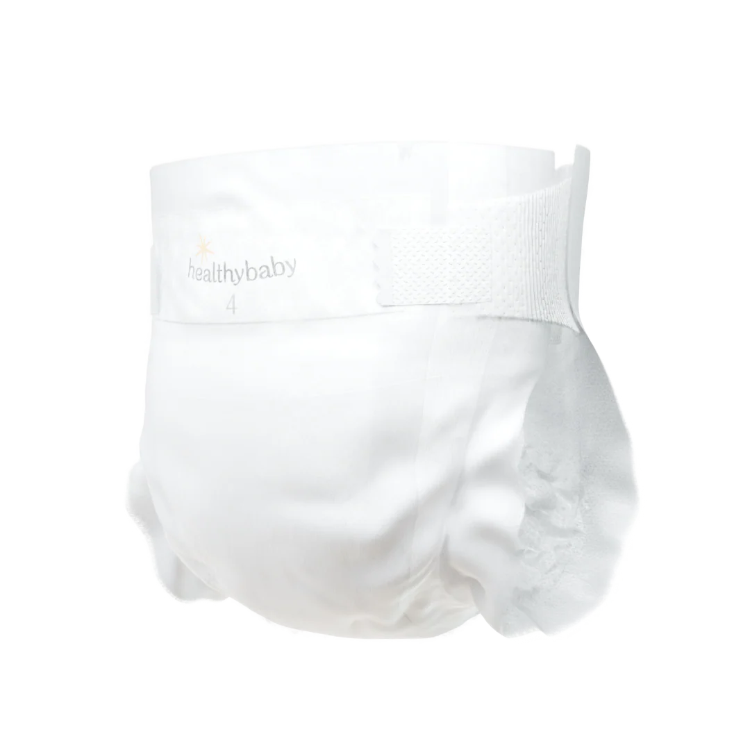 A white disposable baby diaper with elastic sides and a tab closure, displayed against a transparent background. The design appears comfortable and secure.