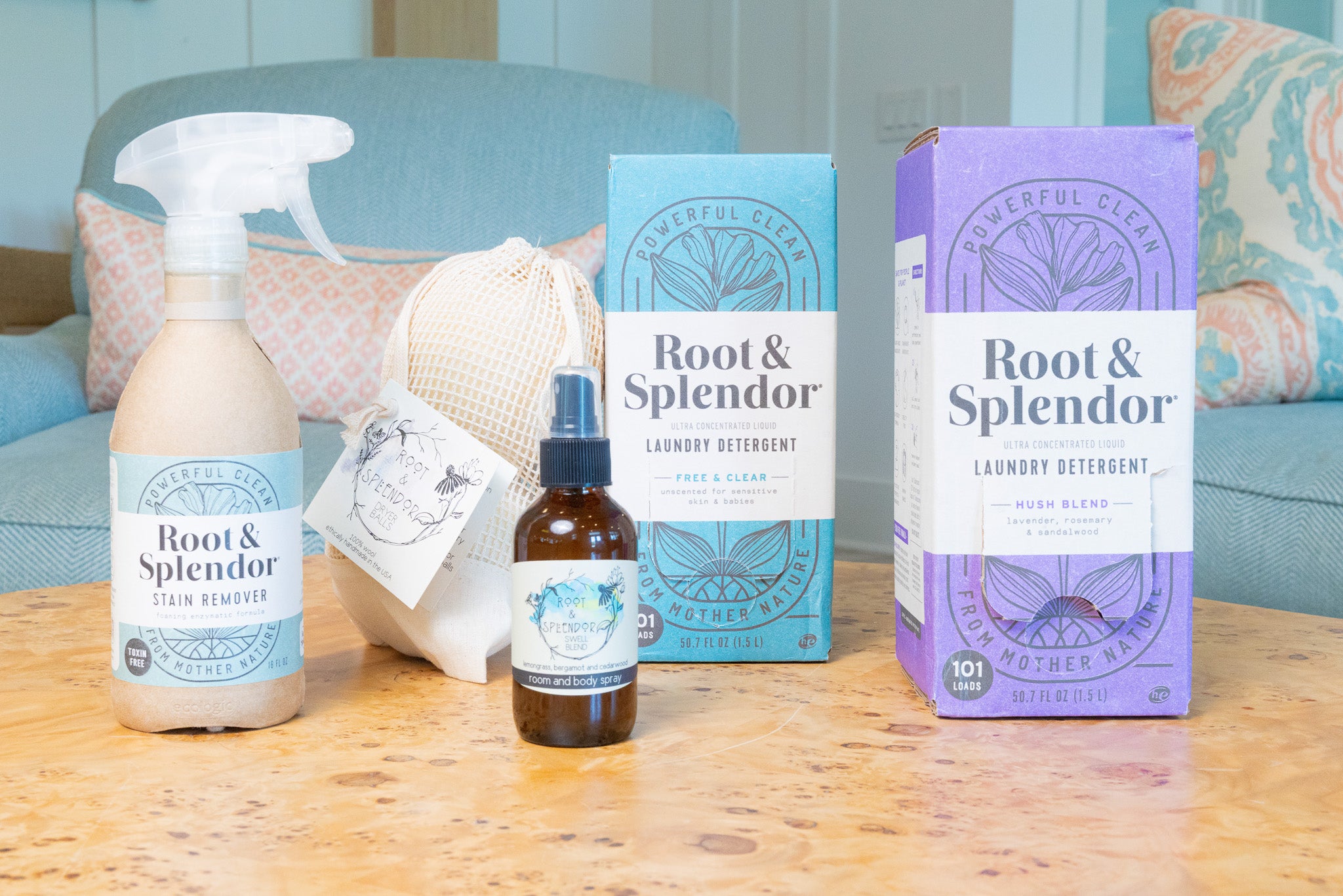 Root & Splendor cleaning products on a wooden surface with a couch in the background