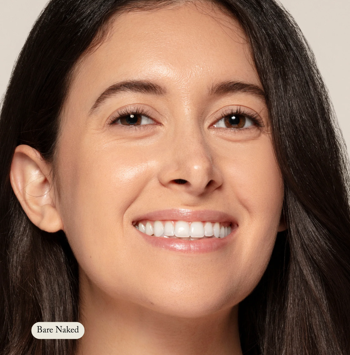Close-up of a woman's face with 'Bare Naked' label on a neutral background