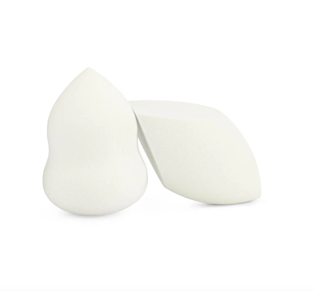 Two white makeup sponges on a white background