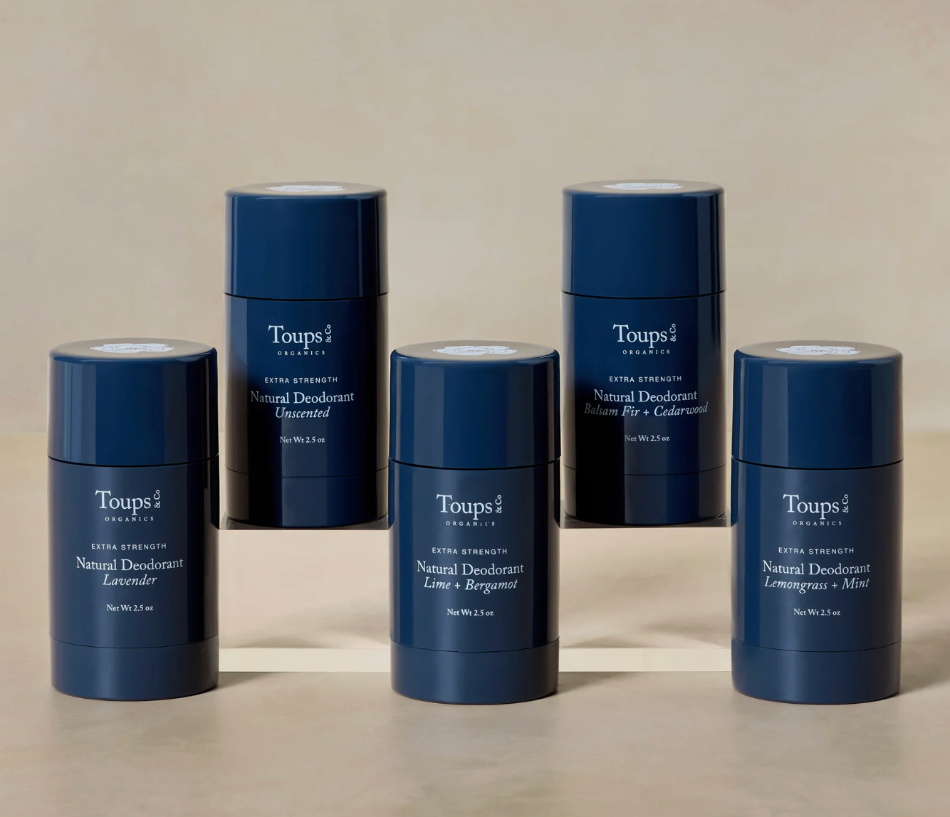 Set of Toups 2 deodorant sticks on a beige background