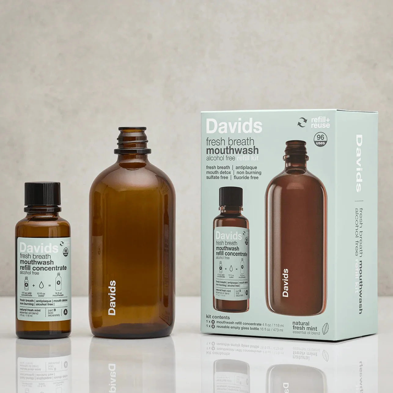 Davids mouthwash bottles and packaging on a reflective surface with a neutral background