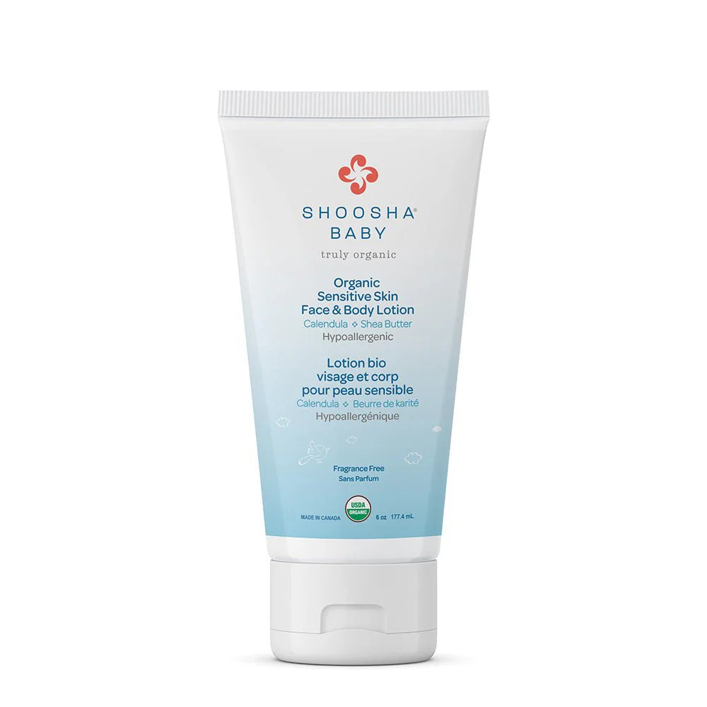 A tube of Shoosha Organic Sensitive Skin Face & Body Lotion with the label showing organic ingredients such as coconut, cocoa, jojoba, and shea butter.