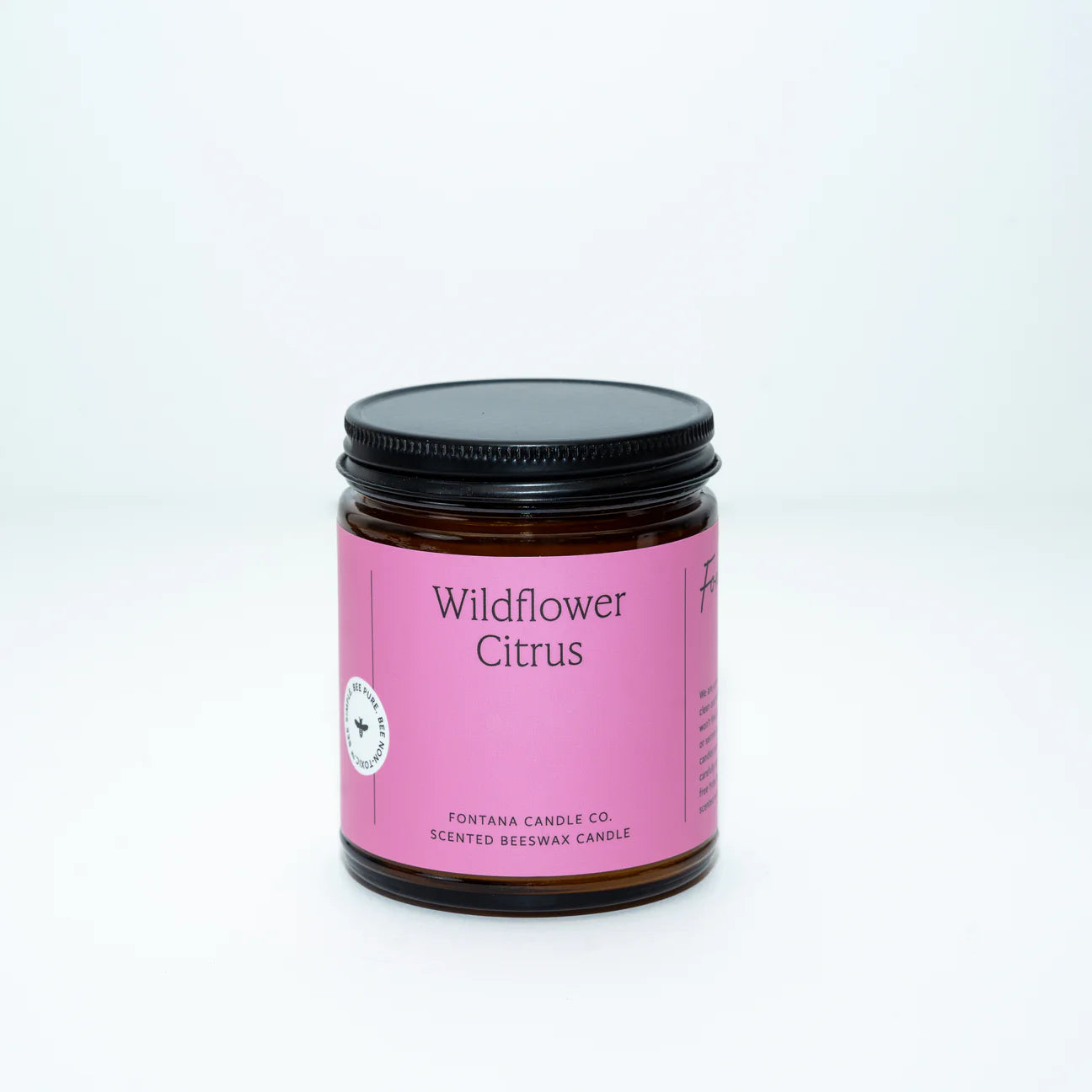 Wildflower citrus Candle jar with pink label on white background
