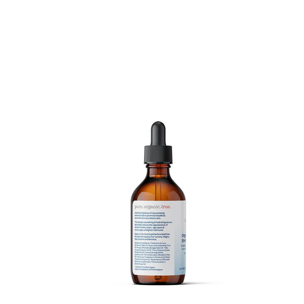 Backside of Brown glass bottle with dropper, labeled "Shosha Rejuvenate Stretch Mark Serum." Features a white label with red logo and green organic certification. Neutral tone.
