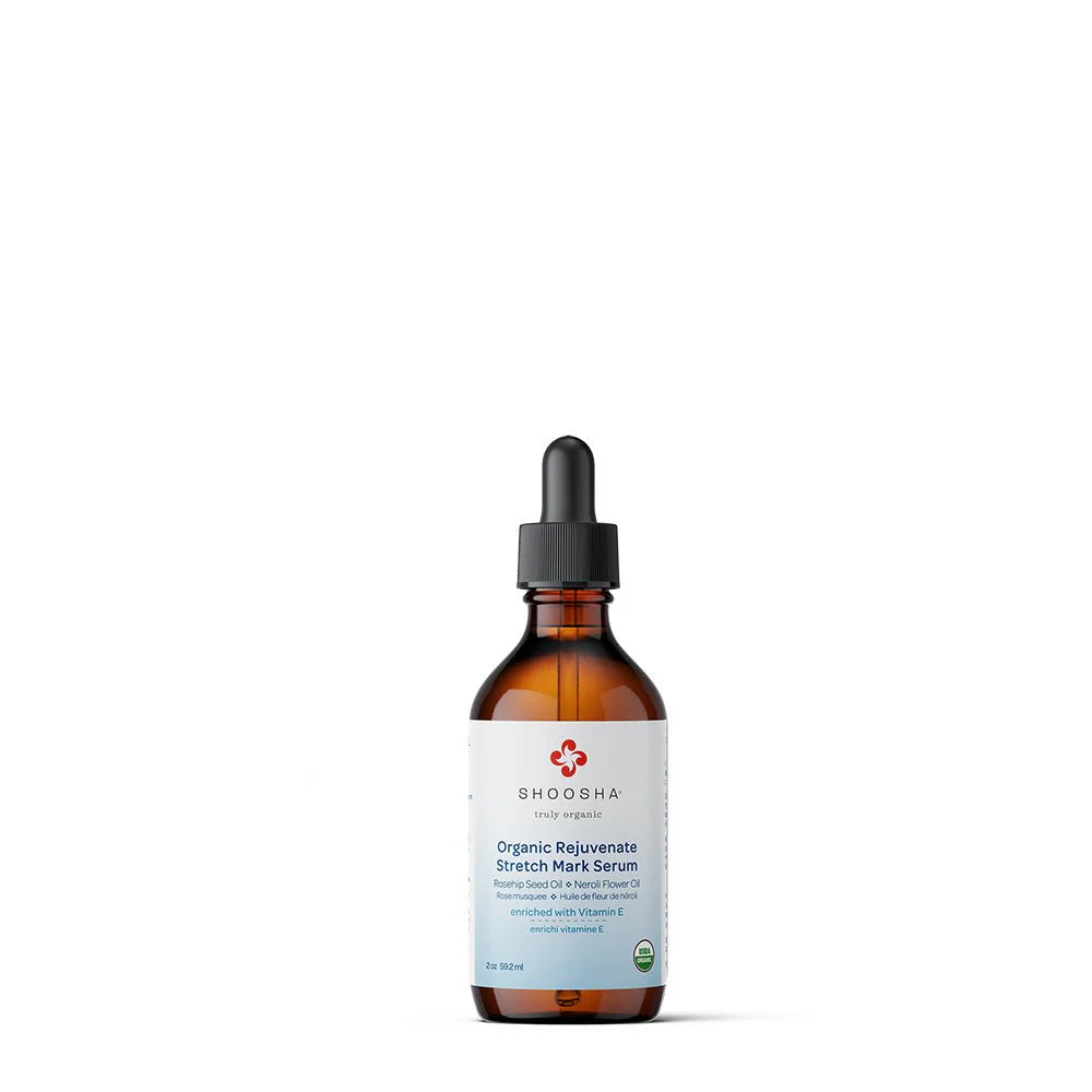 Brown glass bottle with dropper, labeled "Shosha Rejuvenate Stretch Mark Serum." Features a white label with red logo and green organic certification. Neutral tone.