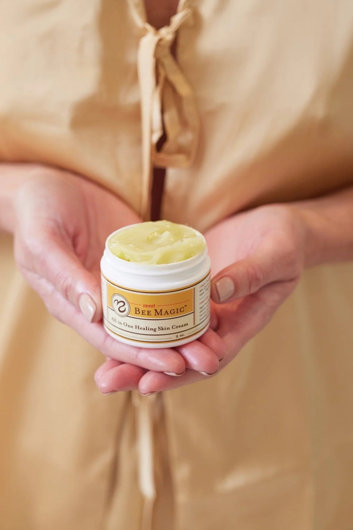 Sweet bee magic cream in hands.
