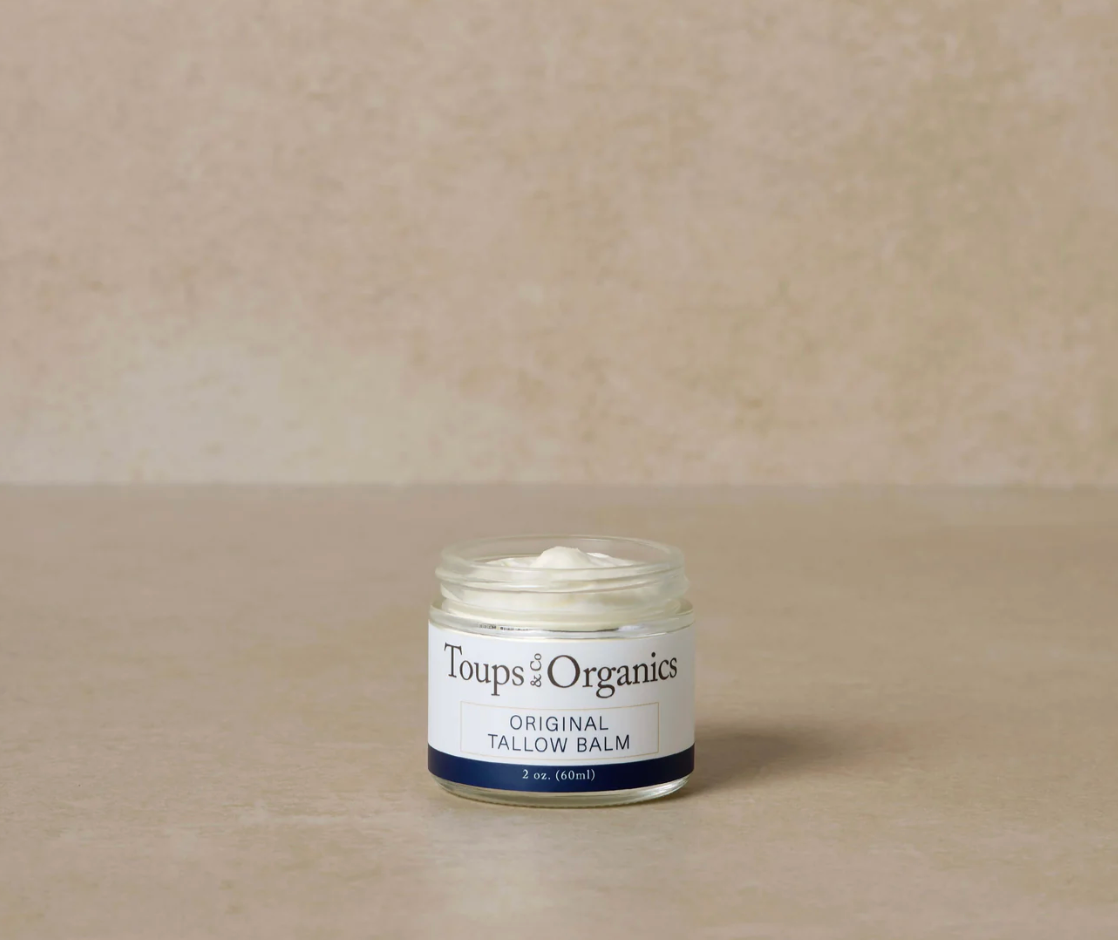 Jar of Toups Organics Original Tallow Balm on a beige background