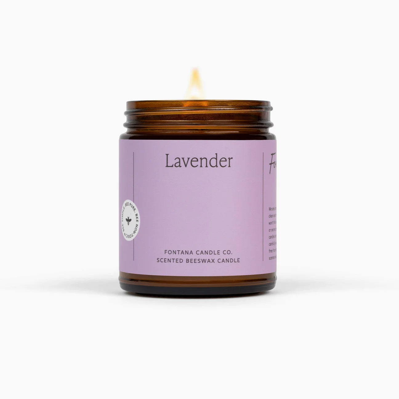 Lavender scented candle with a purple label on a white background